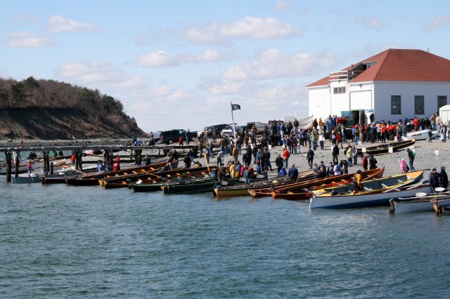 Rowing boats are lined up on the beach at Windmill Point, Hull, Massachusetts at the 2011 “Snow Row”
