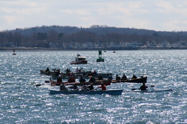 Vergennes High School (third boat from front) powers to the finish line at the “Snow Row” 2011